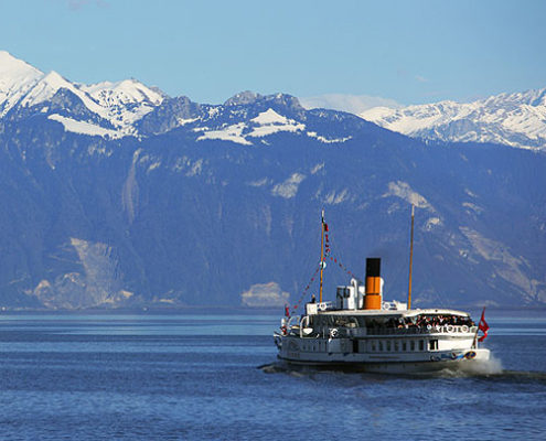 Flagship S/S “LA SUISSE” With the snow-covered Alps in the background, the La Suisse vessel crosses the blue waters of Lake Geneva.